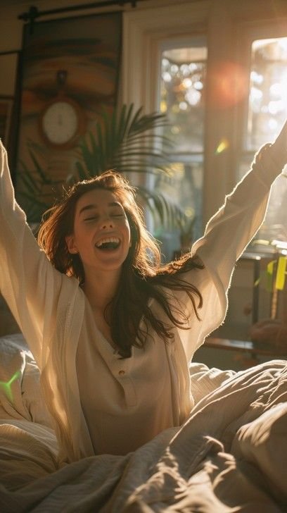 Happy woman waking up in the morning, starting a healthy lifestyle routine with natural light, energy, and wellness – promoting morning habits for weight loss and better health.